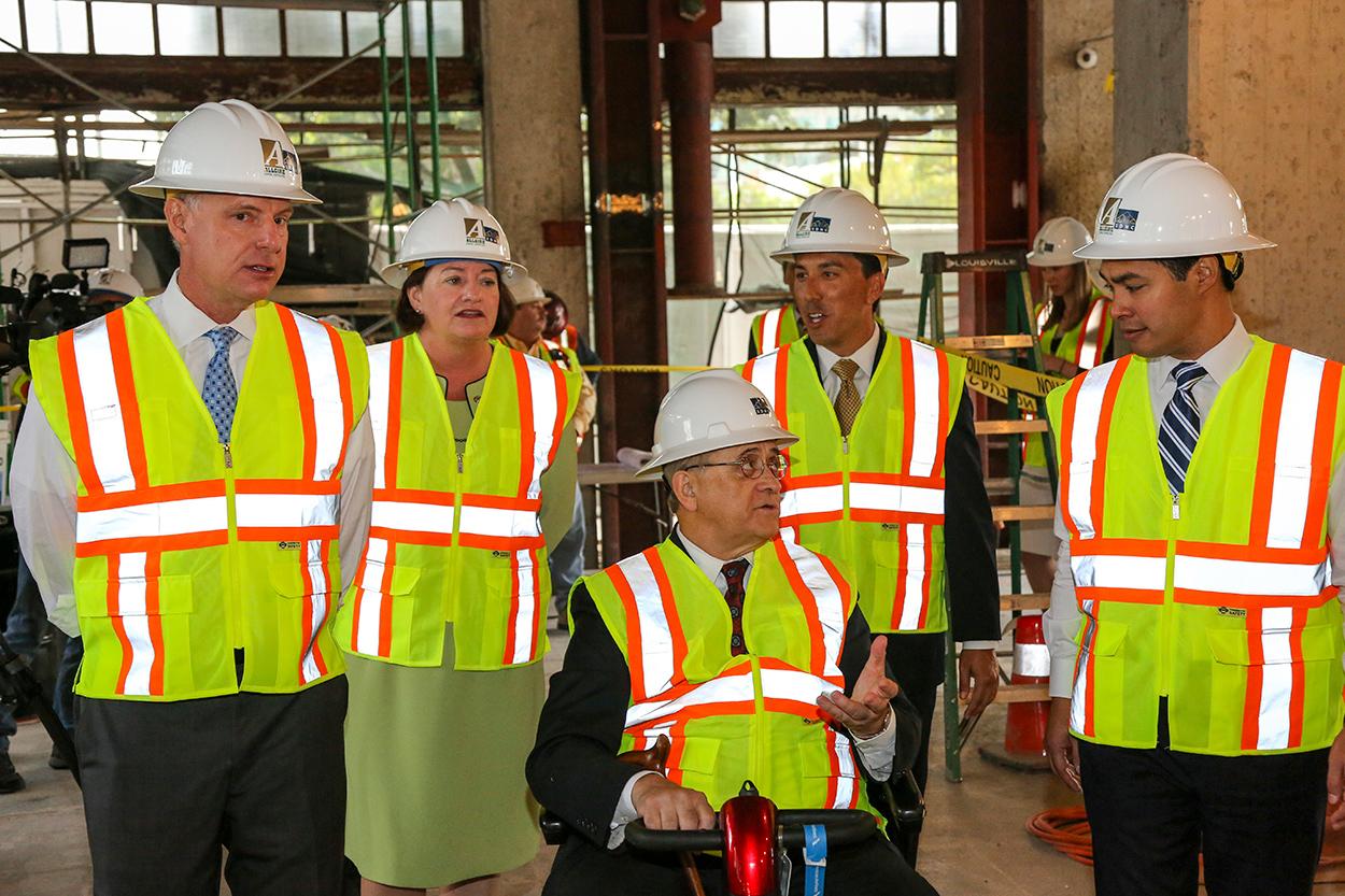 Rick Gentry with other people at a construction site.