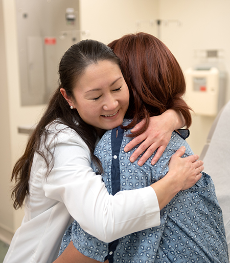 Dr. Akiko Chiba hugs a patient