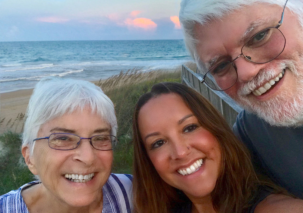 Greg Sprole (right) with wife Cheryl and their youngest daughter, Sarah Sprole Boyle, at the beach.